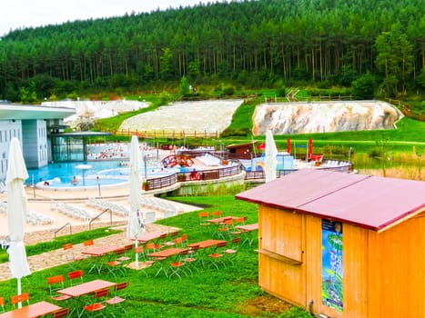 Egerszalok, Hungary - September 27, 2015: People resting in hot water pools of the Saliris resort. The Egerszalok spa pools contain water rich in calcium, magnesium, and hydrocarbonate minerals.