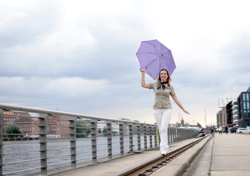 Businesswoman with umbrella
