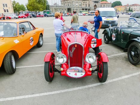 Padua, Italy - September 19, 2014: Benefit Antique Classic Car Show: People are the members and sitting at the car at Benefit Antique Classic Car Show at Padua at September 19, 2014. Cars and enthusiasts from all over Italy.
