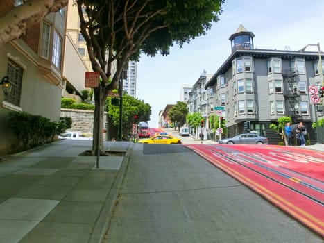 San Francisco, California, United States of America - May 04, 2016: typical San Francisco street with cable car tracks, California