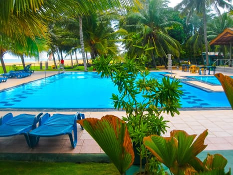 Negombo, Sri Lanka - April 29, 2009: The swimming pool at Camelot Beach Hotel at tropical country Sri Lanka