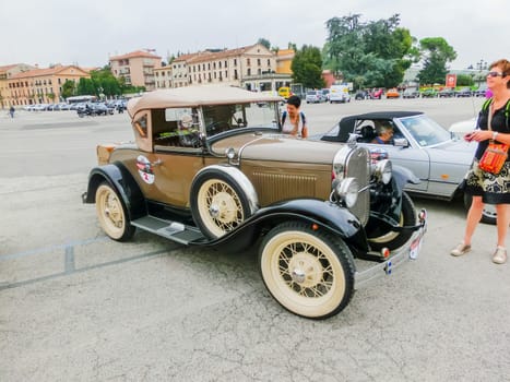 Padua, Italy - September 19, 2014: Benefit Antique Classic Car Show: People visiting Benefit Antique Classic Car Show at Padua at September 19, 2014. Cars and enthusiasts from all over Italy.