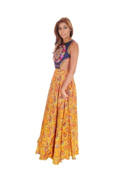 A beautiful young slim woman in a long yellow skirt standing in full .length, isolated for white background..