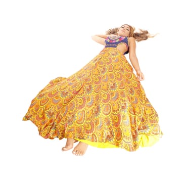 A lovely young woman in a yellow skirt lying on the floor, isolated.for white background..