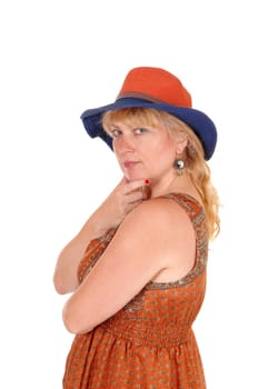 A portrait image of a pretty blond woman in a dress wearing a summer.hat, isolated for white background..