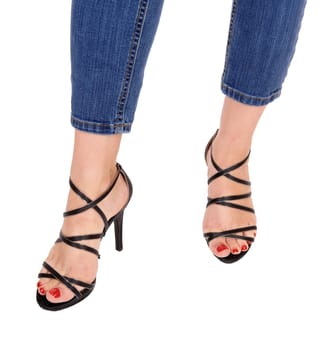 A closeup image of the legs and feet in high heels of a woman, isolated.for white background..