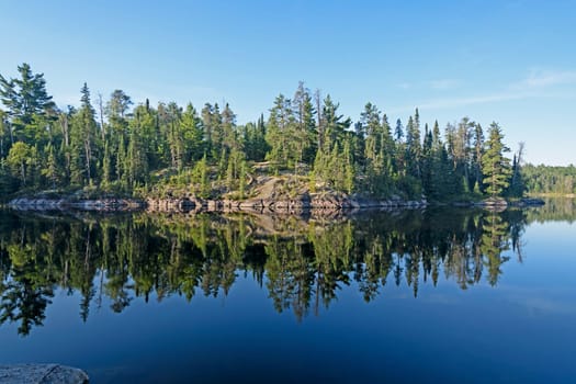 Morning Reflections in Canoe Country on Sidney Lake of Quetico Provincial Park in Ontario