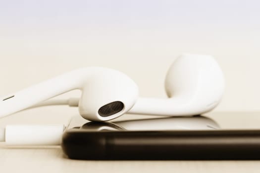 Close-up headphone stack on phone