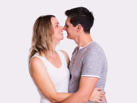 young beautiful couple in front of white background