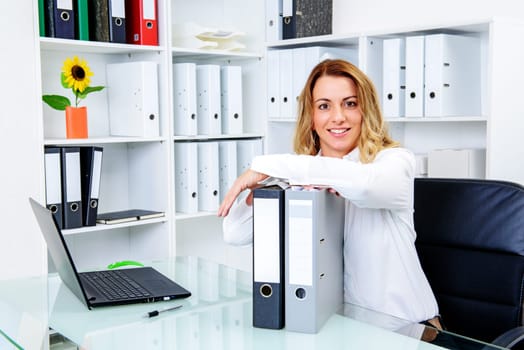 young blond businesswoman working in the office