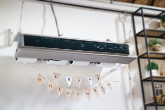 Hanging air conditioner and Halloween flags, stock photo