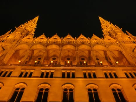 Budapest Parliament in Hungary at night on the Danube river