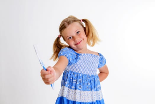 little funny girl with space width and toothbrush