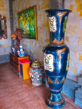 Bali, Indonesia - April 11, 2012: View of wooden furniture, painting, a work of art at Tanah Merah Art Resort