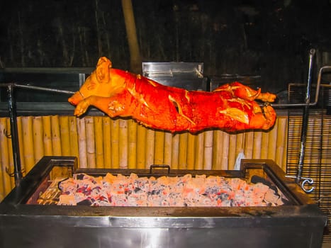 Roasted pig on the spit at Thailand