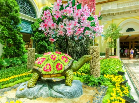 Las Vegas, United States of America - May 05, 2016: The people walking at Japanese flowering garden at luxury hotel Bellagio at Las Vegas, United States of America
