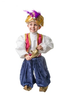 Child smilling in sultan costume with lamp .isolated.