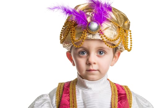 Child in sultan costume on white.