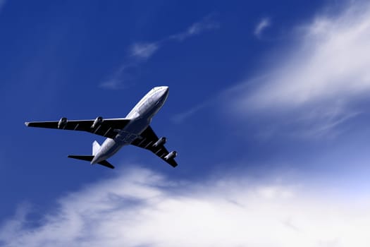 Big airplane flying on blue sky