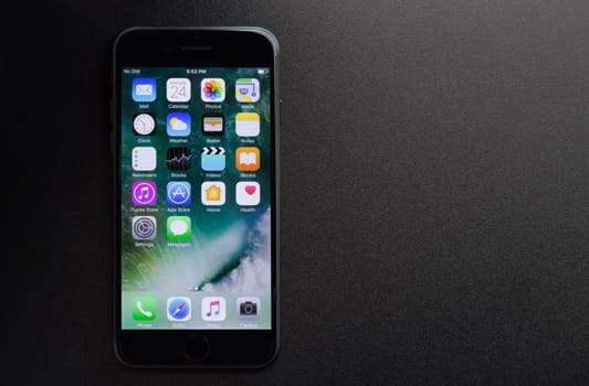 Bangkok, Thailand - November 2, 2016: iPhone 7 showing application screen on black background, new iPhone 7 is manufactured by apple Inc.