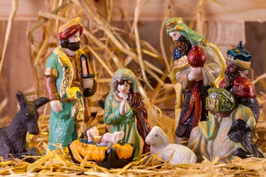 Christmas Manger scene with figurines including Jesus, Mary and magi. Focus on Mary!.
