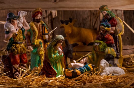 nativity scene with hand-colored figures made out of wood. Focus on  Mary!