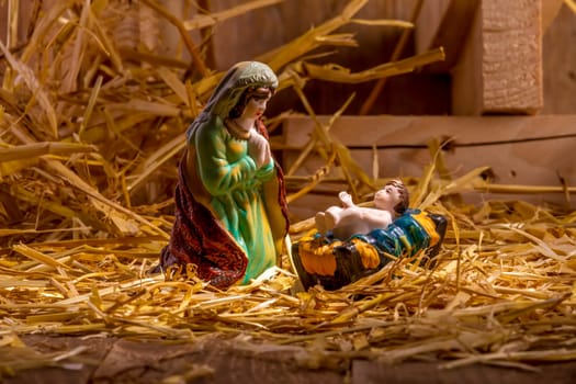 Christmas Manger scene with figurines including Jesus and Mary. Focus on Mary!