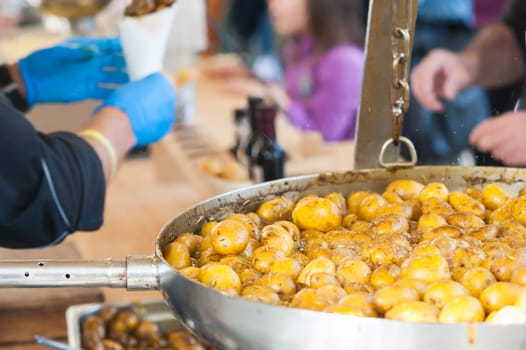 New potatoes. Fried in a pan. Italian recipe: potatoes cooked to Salento. Selective focus.