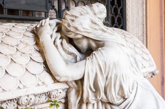 More than 150 years old statue. Cemetery located in North Italy.