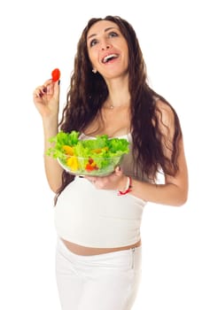 Pregnant woman eating chopped salad, isolated on white.