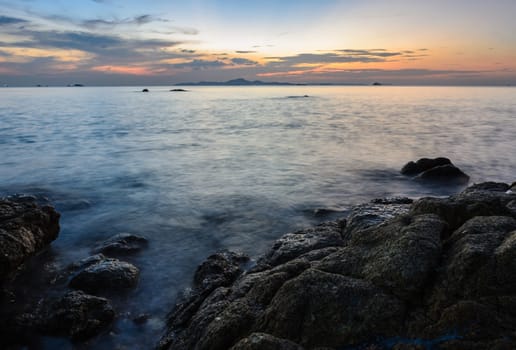 Rock beach sunset skyline afterglow
