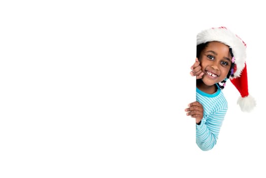 Happy young girl with Santa's hat posing with big board