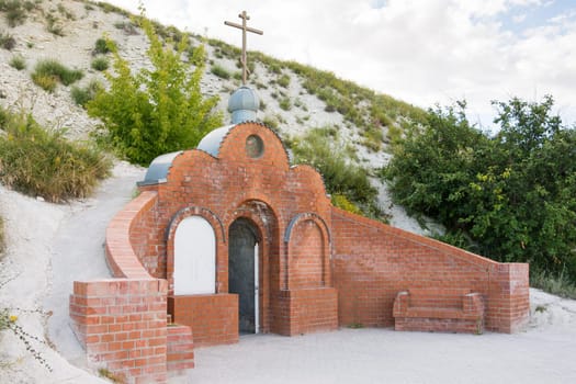 Olkhovka, Russia - July 10, 2016: Entrance to the cave monastery of Holy Trinity Stone-Brodsky Monastery in olkhovsky district of the Volgograd region, Russia
