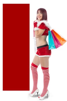 beautiful sexy girl dressed like Santa with Christmas presents