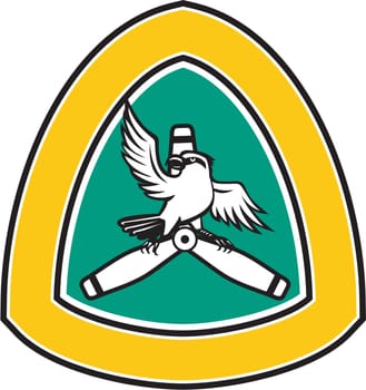 Illustration of a shrike, a carnivorous passerine birds of the family Laniidae perching on a propeller blade looking to the side with spread wings viewed from front set inside shield crest on isolated background done in retro style.