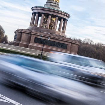traffic at siegessäule berlin on a winter day
