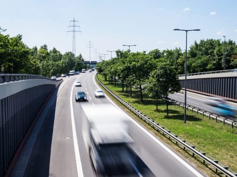 fast cars on highway in summer time