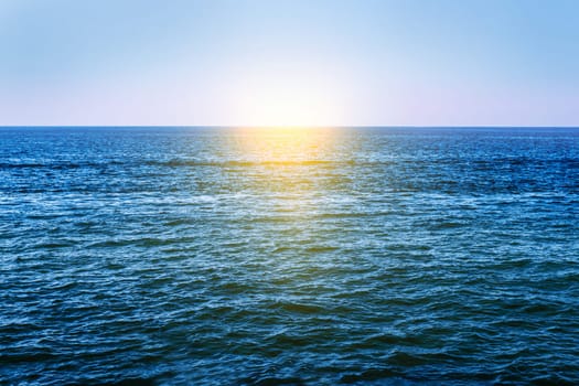 dark blue water in the ocean and sun
