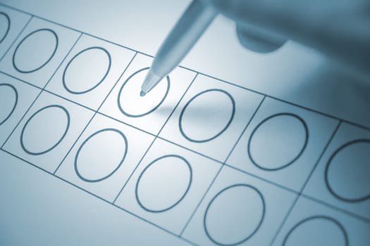 secret election, ballot papers and pen in blue light