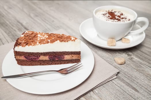 cake and coffee on wood table