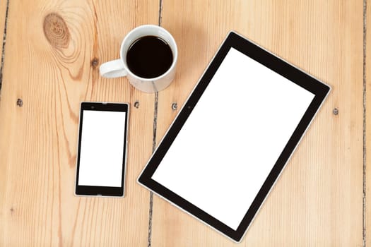 tablet and smartphone on wooden floor