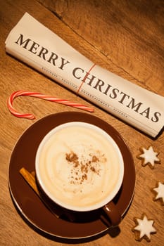 merry christmas newspaper and cup of cappucino