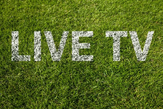 live tv text on a green meadow