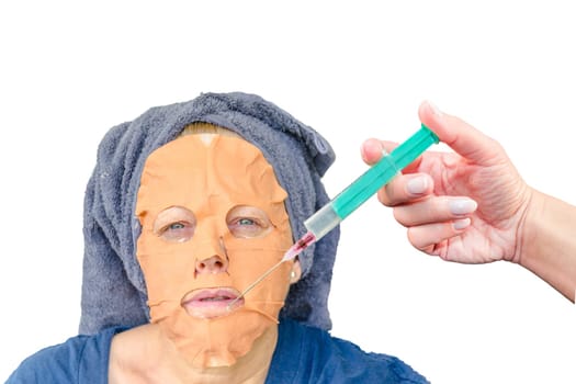Close-up portrait of a cosmetic face mask as well as a botulinum injection in the female face lip zone.