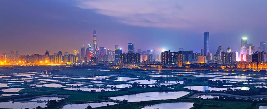 Shenzhen citscape at night , view from hiong kong countryside