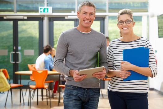 Portrait Of Male And Female Tutors In Classroom