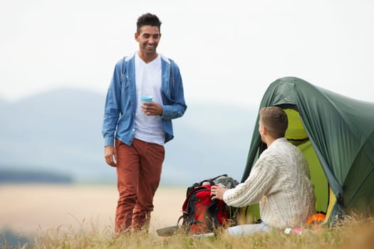 Two Young Men On Camping Trip In Countryside