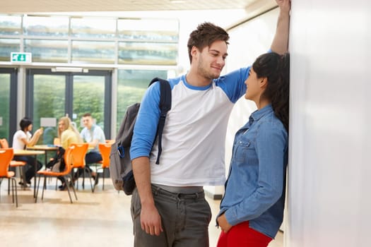 Teenage Couple Talking In School Classroom