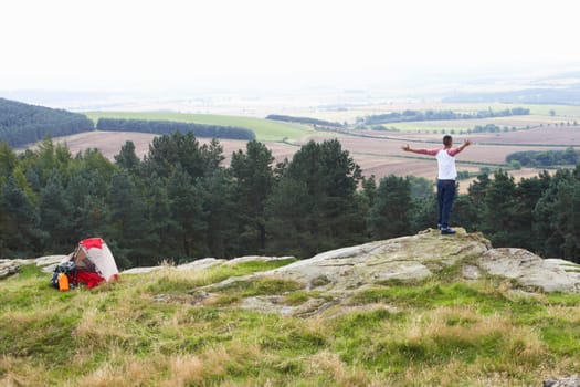 Young Man On Camping Trip In Countryside
