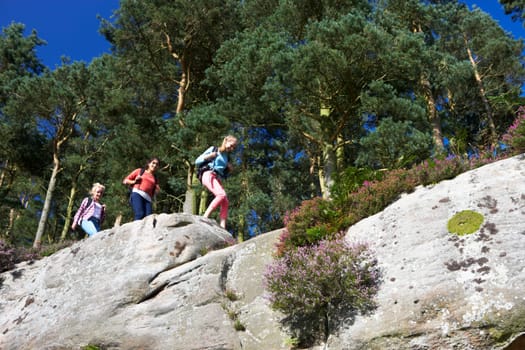 Group Of Teenage Girls Hiking In Countryside